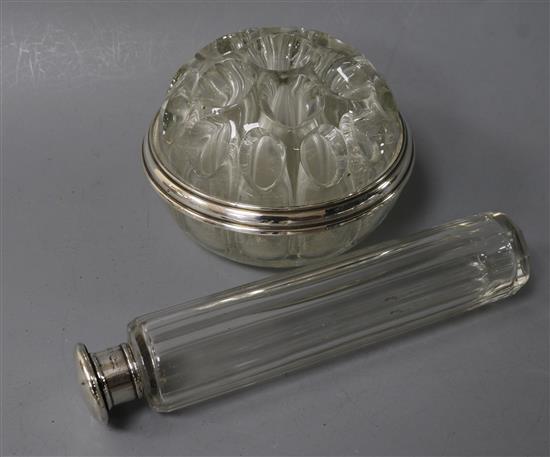 A French silver-mounted flower holder and a silver and glass toilet bottle.